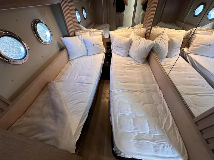 Skyfall Yacht Photos Pics Interior of Absolute 52 Navetta 2022 with twin beds and portholes.