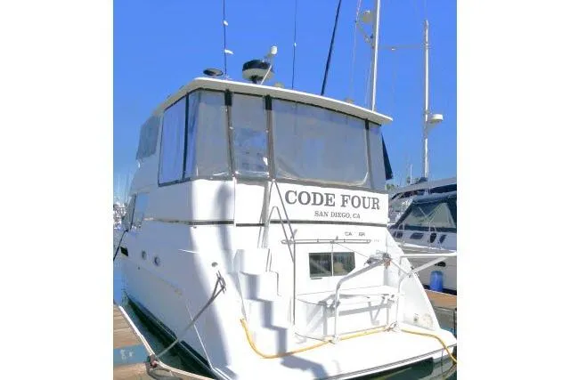 Code Four Yacht Photos Pics Carver 406 Motor Yacht 2000 docked, rear view with "Code Four" signage, San Diego, CA.
