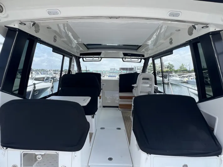  Yacht Photos Pics Interior view of 2021 Boston Whaler 405 Conquest boat, featuring spacious seating and modern design.
