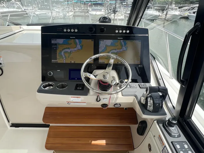  Yacht Photos Pics Helm of 2021 Boston Whaler 405 Conquest with dual navigation screens and steering wheel.