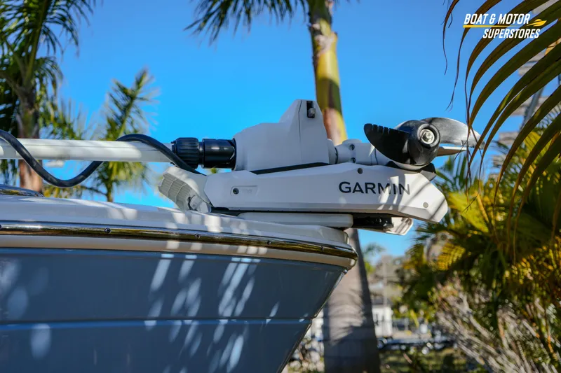  Yacht Photos Pics 2025 Blackfin 242 HB boat with Garmin equipment, surrounded by palm trees.