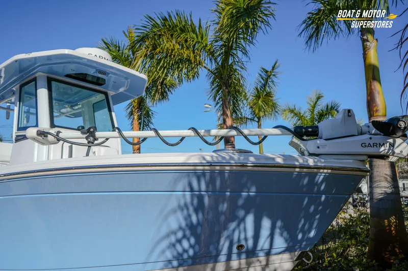  Yacht Photos Pics 2025 Blackfin 242 HB boat with Garmin equipment, surrounded by palm trees.