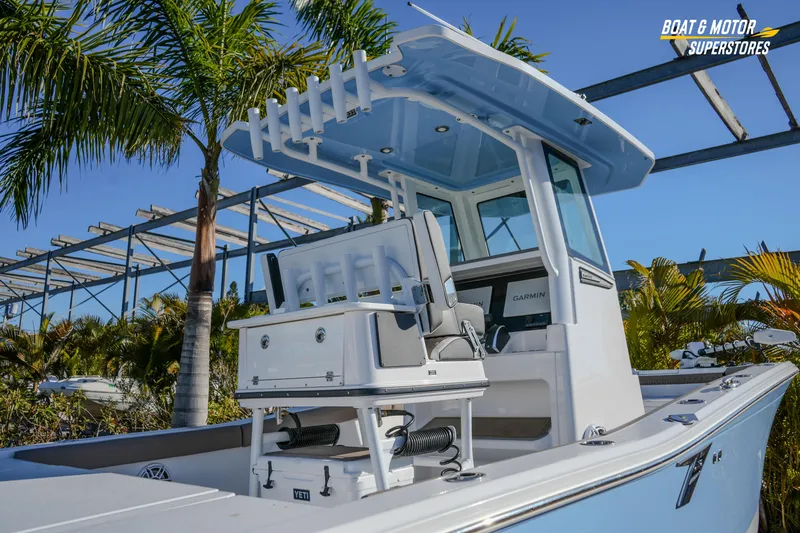  Yacht Photos Pics 2025 Blackfin 242 HB boat with modern console, palm trees in background.
