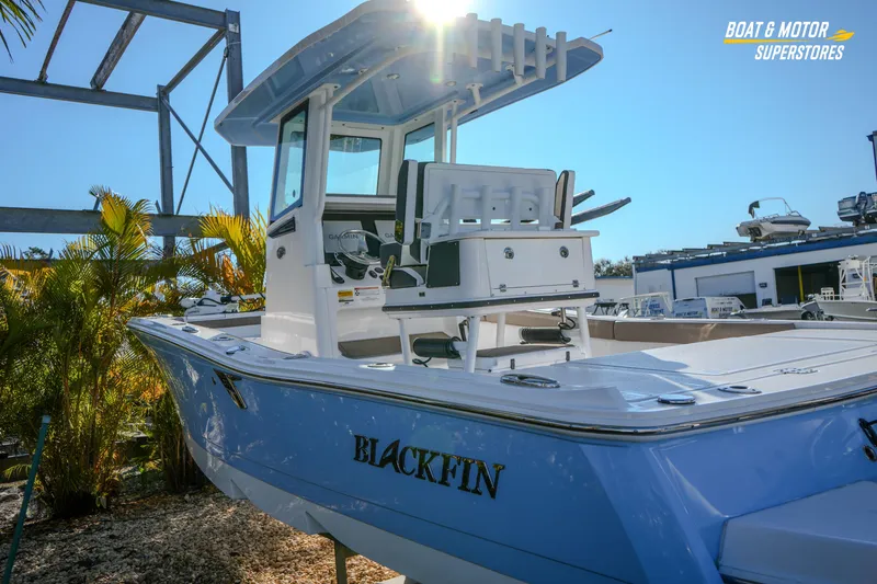  Yacht Photos Pics 2025 Blackfin 242 HB boat displayed outdoors under clear blue sky.