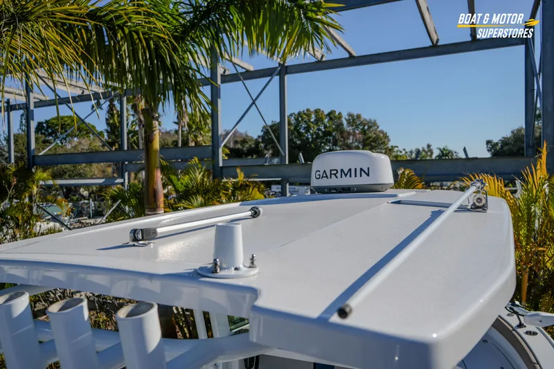  Yacht Photos Pics 2025 Blackfin 242 HB boat with Garmin equipment, surrounded by palm trees.