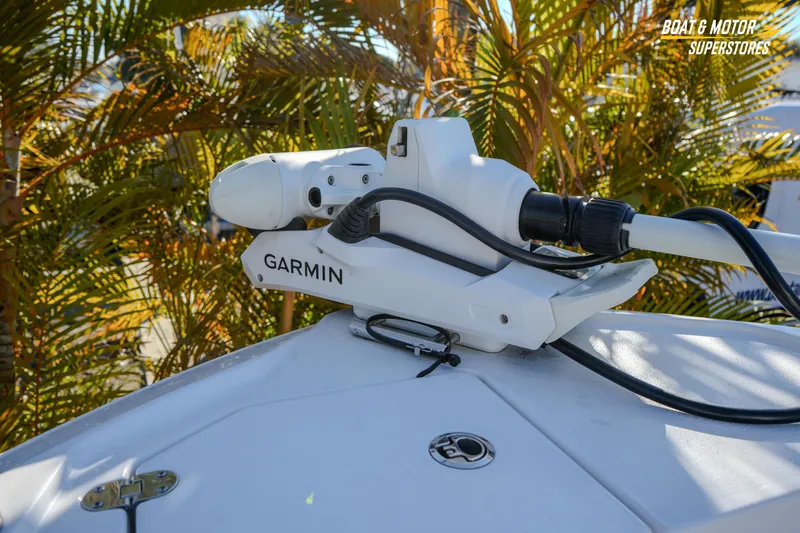  Yacht Photos Pics Garmin equipment on 2025 Blackfin 242 HB boat, surrounded by tropical foliage.
