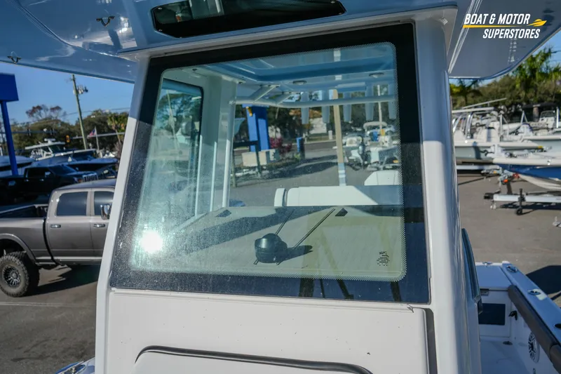  Yacht Photos Pics 2025 Blackfin 242 HB boat windshield at dealership, showcasing sleek design and modern features.