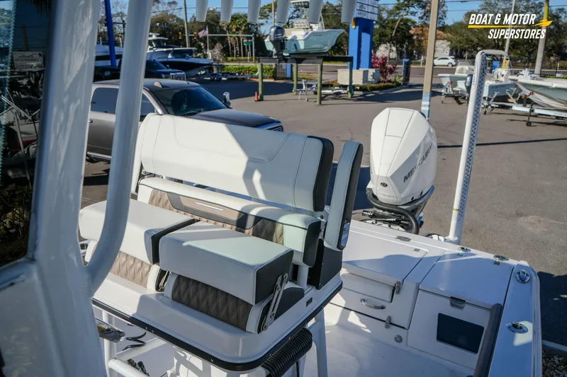  Yacht Photos Pics 2025 Blackfin 242 HB boat interior with seating and Mercury outboard motor.