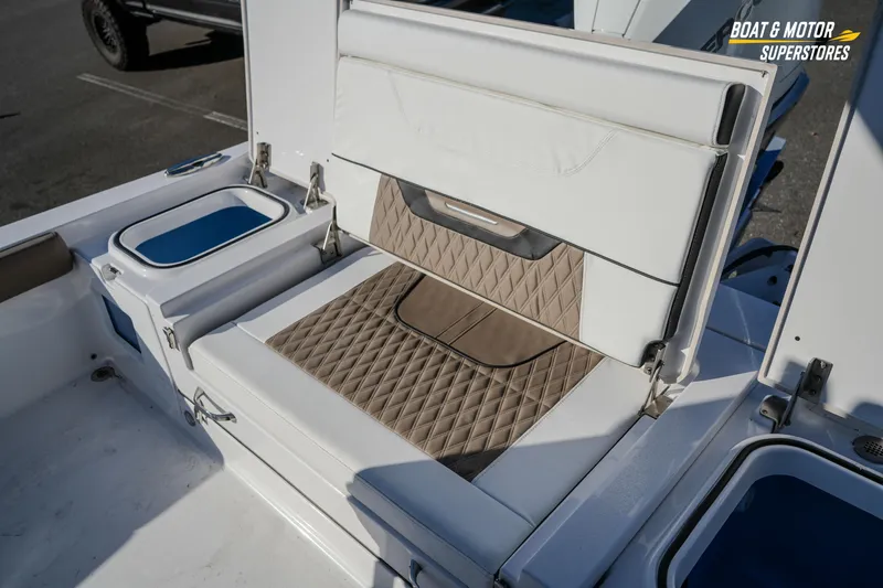  Yacht Photos Pics 2025 Blackfin 242 HB boat interior with cushioned seating and storage compartments.