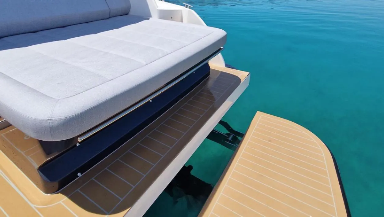Luxury seating on Focus Power 36 yacht, 2025 model, with clear blue water backdrop.