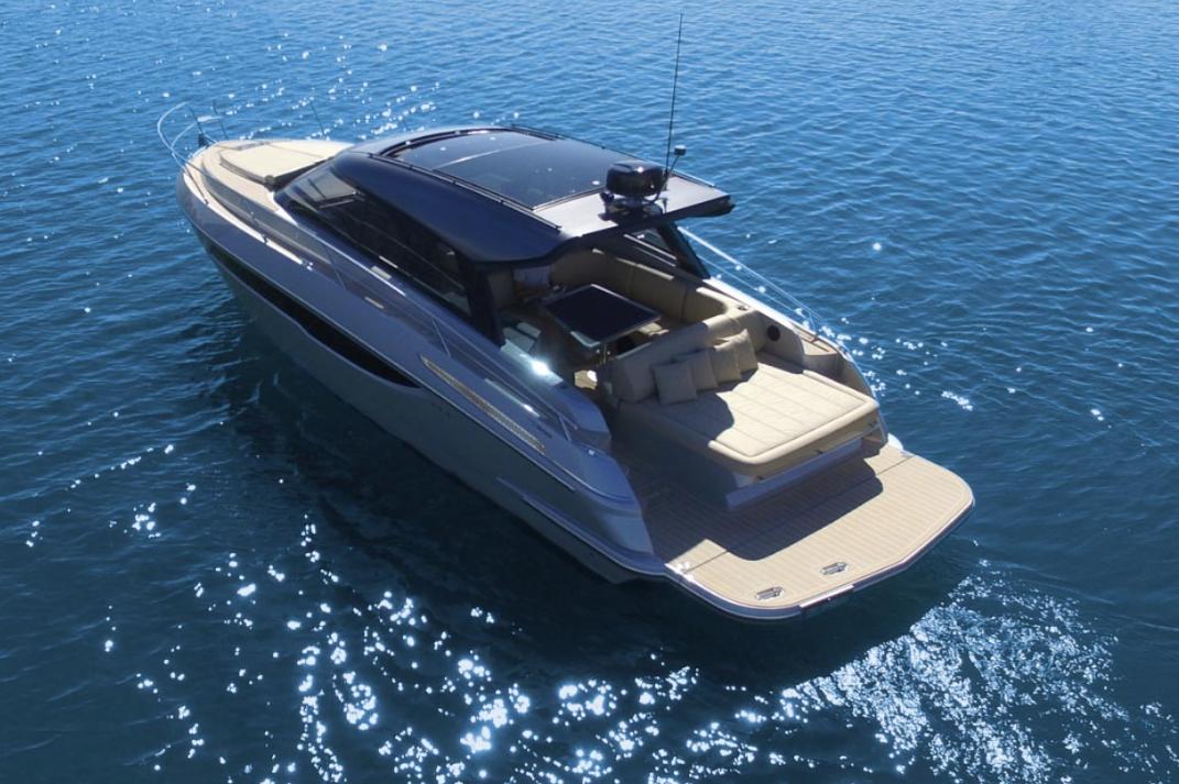 Luxury 2025 Focus Power 36 yacht cruising on clear blue water.