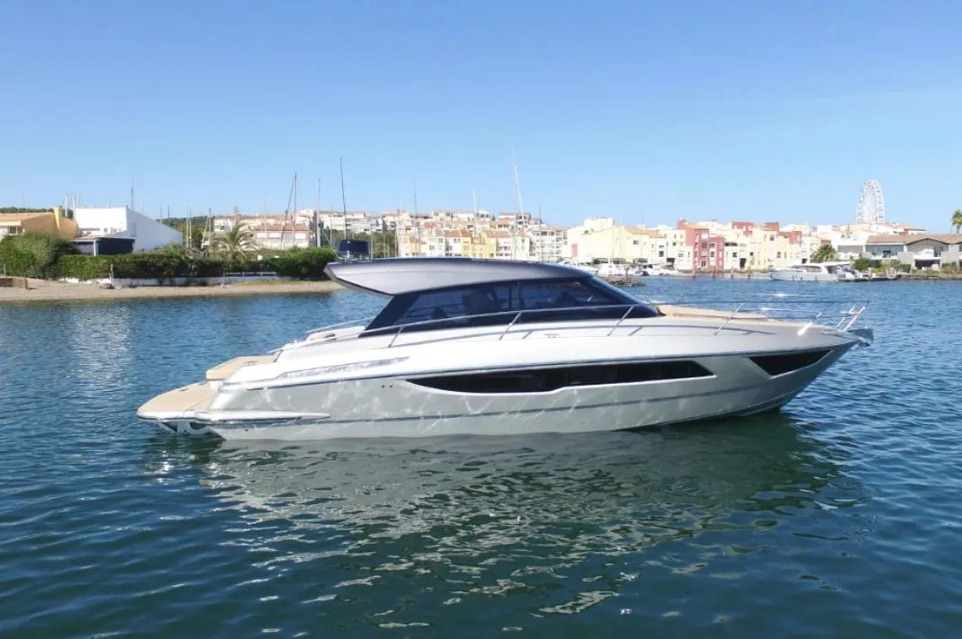 2025 Focus Power 36 yacht on calm water with cityscape background.