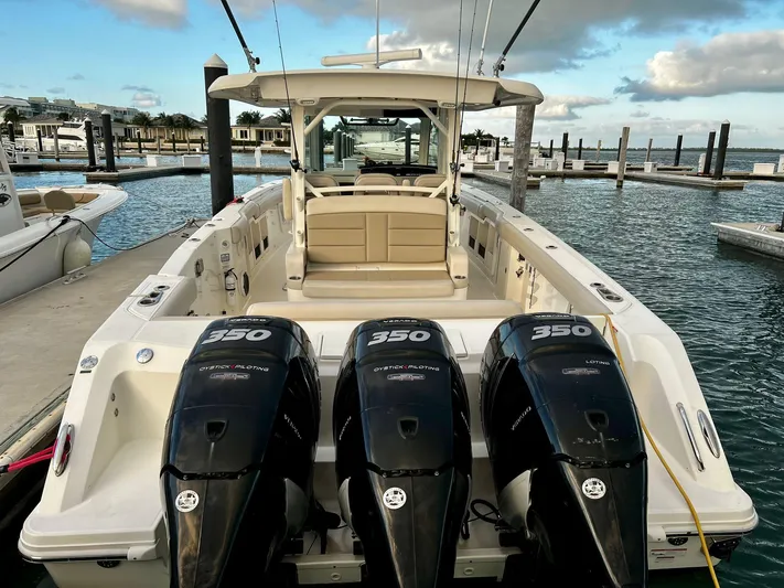  Yacht Photos Pics 2019 Boston Whaler 380 Outrage with triple 350 engines docked at marina.