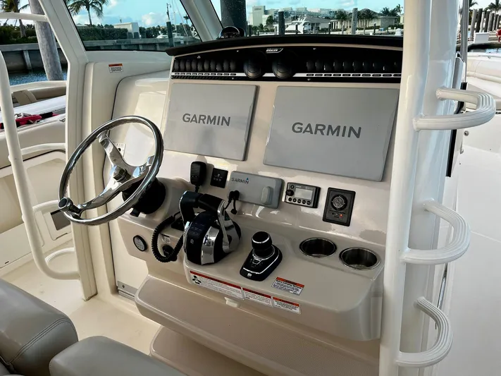  Yacht Photos Pics 2019 Boston Whaler 380 Outrage helm with dual Garmin displays and controls.