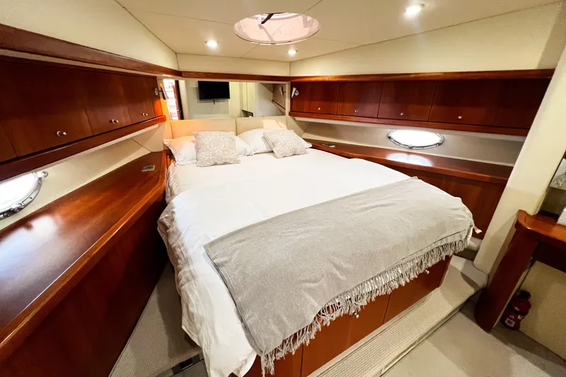  Yacht Photos Pics Luxurious cabin interior of 2007 Sunseeker Manhattan 66 yacht with cozy bedding.