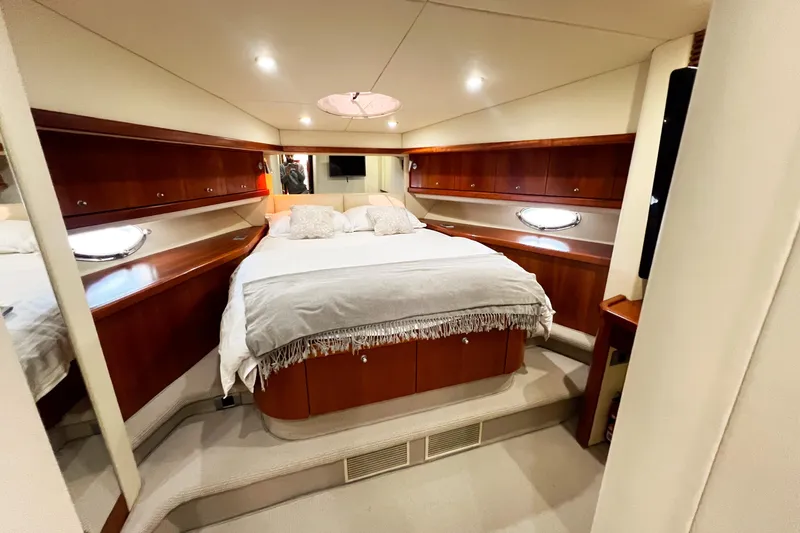  Yacht Photos Pics Luxurious cabin interior of 2007 Sunseeker Manhattan 66 yacht with elegant wood finishes.