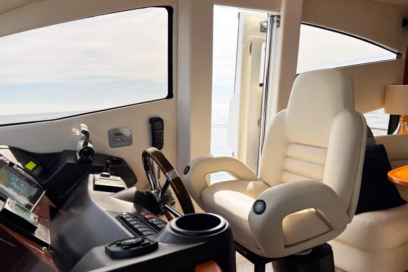  Yacht Photos Pics Luxurious helm of 2007 Sunseeker Manhattan 66 yacht with plush captain's chair.