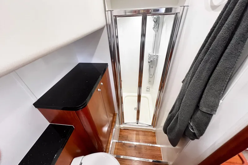  Yacht Photos Pics Luxurious bathroom interior of 2007 Sunseeker Manhattan 66 yacht with shower and cabinetry.