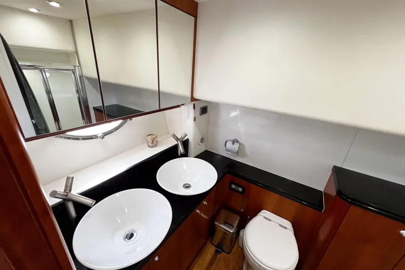  Yacht Photos Pics Luxurious bathroom in 2007 Sunseeker Manhattan 66 yacht with dual sinks and modern fixtures.