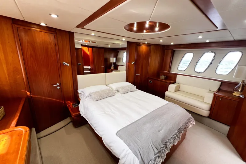  Yacht Photos Pics Luxurious cabin interior of 2007 Sunseeker Manhattan 66 yacht with elegant wood finishes.
