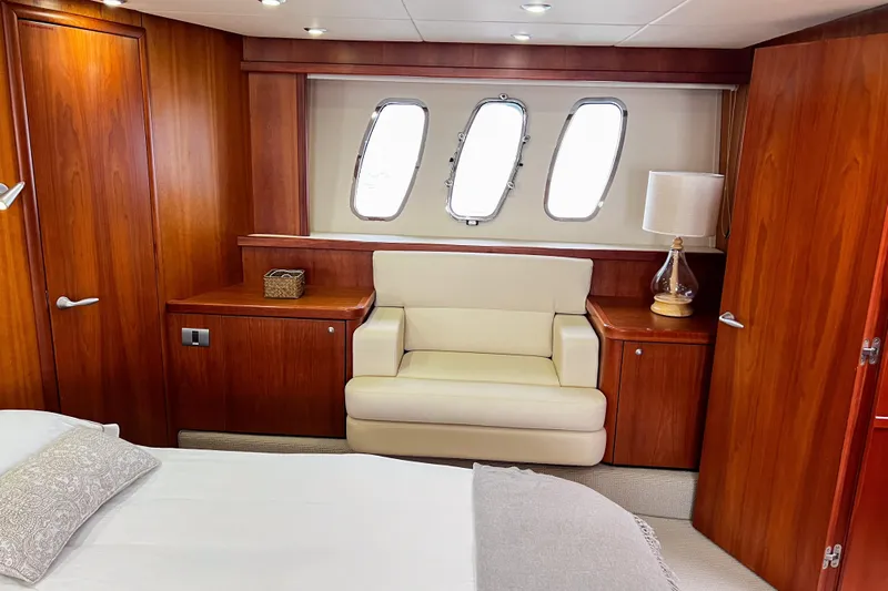  Yacht Photos Pics Luxurious cabin interior of 2007 Sunseeker Manhattan 66 yacht with wood paneling.