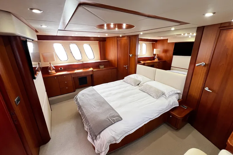  Yacht Photos Pics Luxurious bedroom interior of 2007 Sunseeker Manhattan 66 yacht with elegant wood finishes.