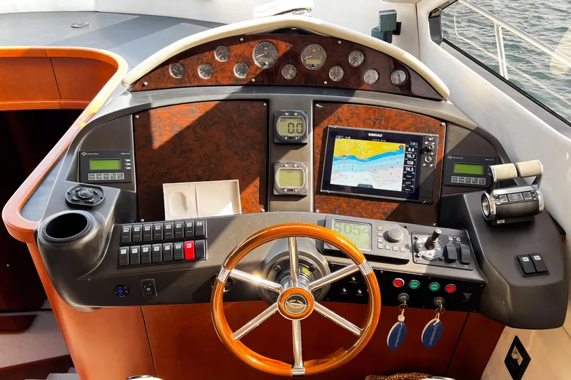  Yacht Photos Pics Cockpit of 2007 Sunseeker Manhattan 66 yacht with navigation instruments and steering wheel.