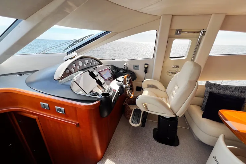  Yacht Photos Pics Luxurious 2007 Sunseeker Manhattan 66 yacht interior with modern helm and ocean view.