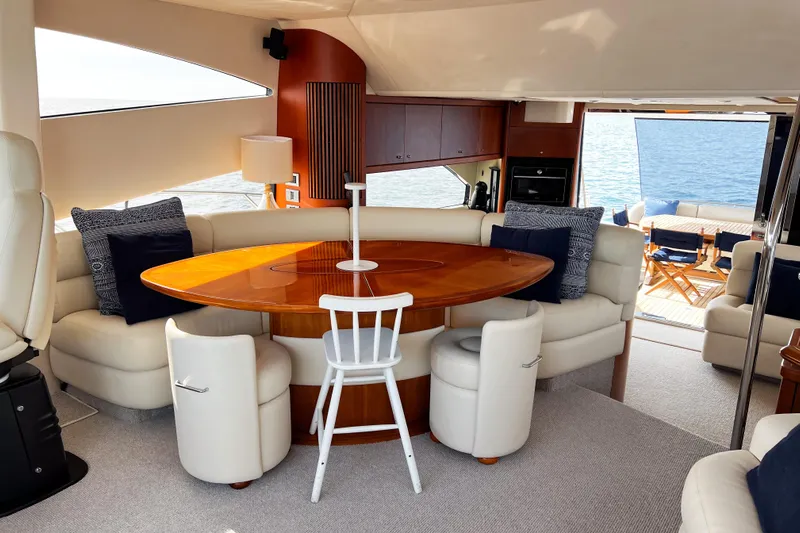  Yacht Photos Pics Luxurious interior of 2007 Sunseeker Manhattan 66 yacht with elegant seating and ocean view.