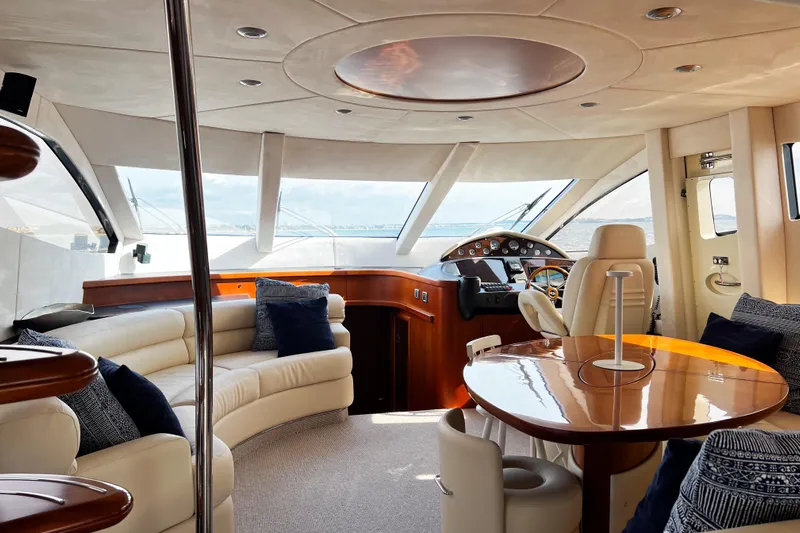  Yacht Photos Pics Luxurious interior of a 2007 Sunseeker Manhattan 66 yacht with elegant seating and helm.