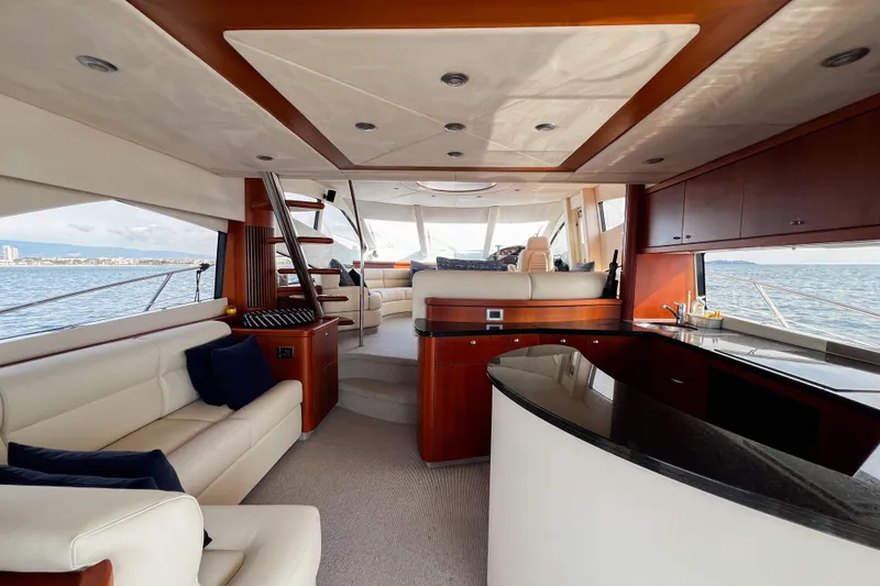  Yacht Photos Pics Luxurious interior of 2007 Sunseeker Manhattan 66 yacht with elegant seating and panoramic windows.