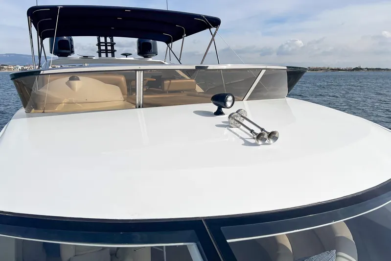  Yacht Photos Pics 2007 Sunseeker Manhattan 66 yacht on calm waters, showcasing sleek design and modern features.