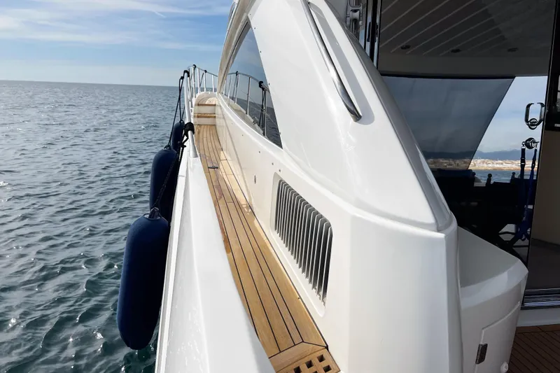  Yacht Photos Pics Side view of 2007 Sunseeker Manhattan 66 yacht on calm sea.