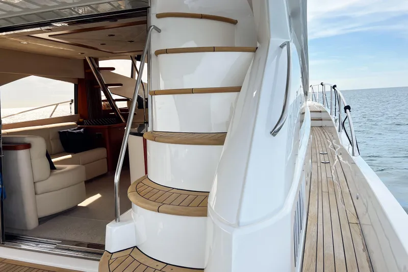  Yacht Photos Pics Luxurious 2007 Sunseeker Manhattan 66 yacht interior with elegant staircase and ocean view.