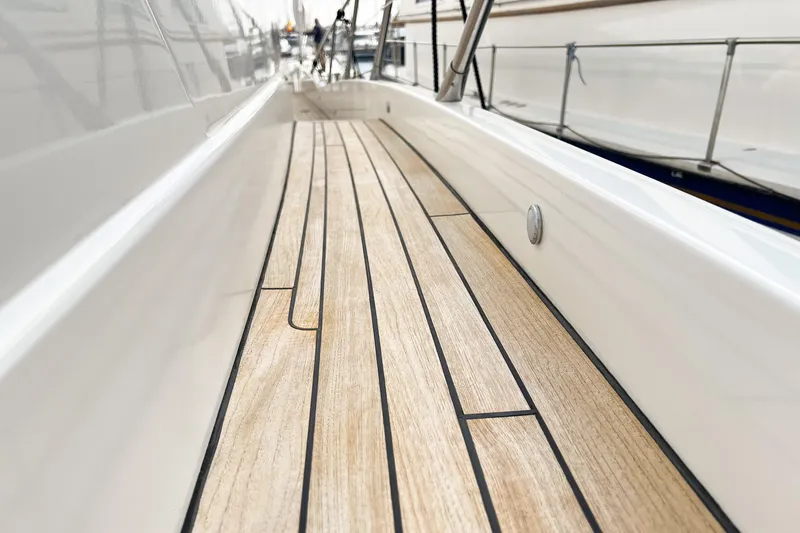  Yacht Photos Pics Teak deck of 2007 Sunseeker Manhattan 66 yacht, showcasing sleek design and craftsmanship.