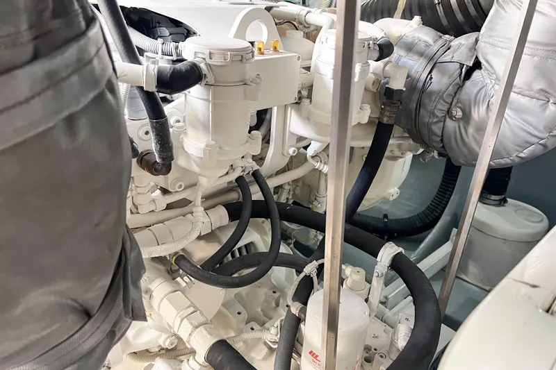  Yacht Photos Pics Engine room of a 2007 Sunseeker Manhattan 66 yacht, showcasing mechanical components.