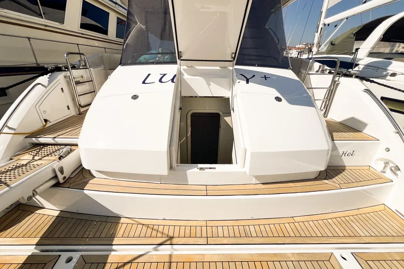  Yacht Photos Pics Sunseeker Manhattan 66 yacht, 2007 model, featuring teak deck and open hatch.