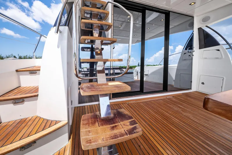  Yacht Photos Pics Prestige 560 Flybridge 2017 yacht with wooden deck and modern staircase.