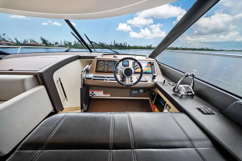  Yacht Photos Pics Luxurious 2017 Prestige 560 Flybridge yacht helm with modern controls and panoramic view.