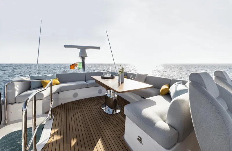  Yacht Photos Pics Luxurious 2024 Azimut Fly 53 yacht deck with elegant seating and ocean view.