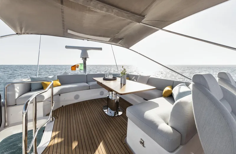  Yacht Photos Pics Luxurious 2024 Azimut Fly 53 yacht deck with elegant seating and ocean view.