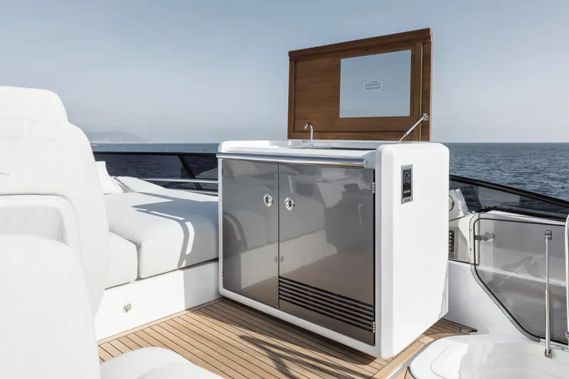  Yacht Photos Pics 2024 Azimut Fly 53 yacht deck with sleek outdoor kitchenette and ocean view.