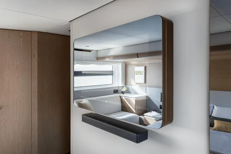  Yacht Photos Pics Modern interior of 2024 Azimut Fly 53 yacht with sleek mirror and cozy seating area.