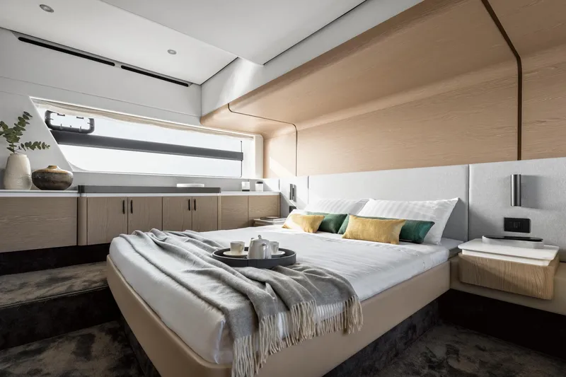  Yacht Photos Pics Luxurious bedroom interior of 2024 Azimut Fly 53 yacht with modern design and cozy decor.