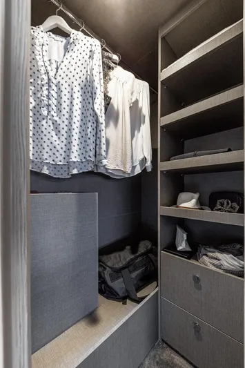  Yacht Photos Pics 2024 Azimut Fly 53 yacht closet with hanging clothes and shelves.