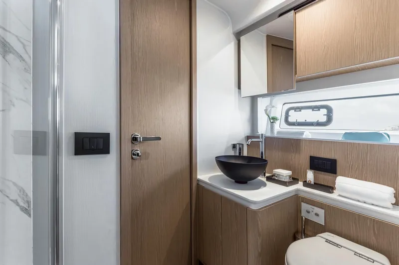  Yacht Photos Pics Luxurious bathroom interior of 2024 Azimut Fly 53 yacht with modern fixtures.