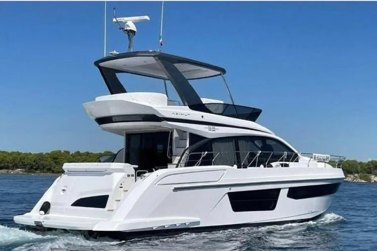  Yacht Photos Pics 2024 Azimut Fly 53 yacht cruising on a clear blue sea.