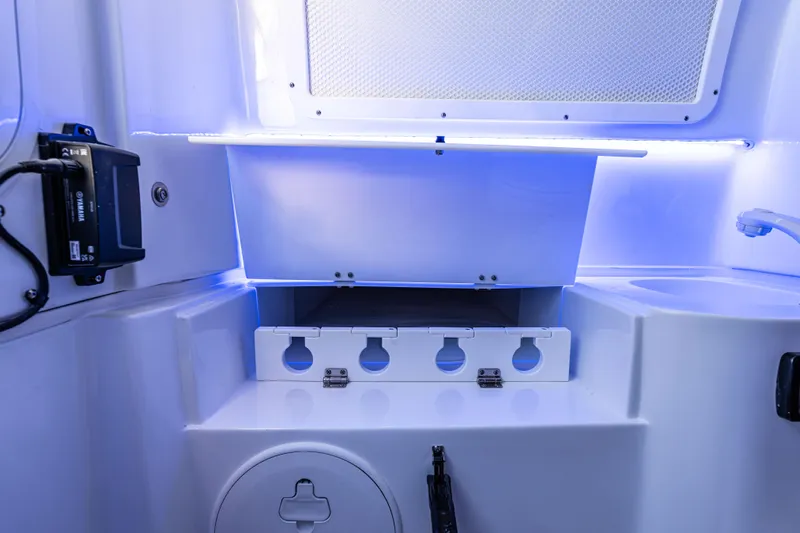  Yacht Photos Pics Interior of 2026 Sea Hunt Ultra 305 Coffin Box with storage compartments and blue lighting.