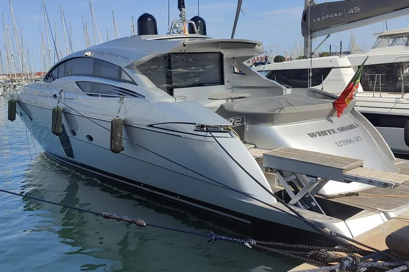 White Shark I Yacht Photos Pics 2010 Pershing 72 yacht docked in marina, sleek design, luxury vessel.