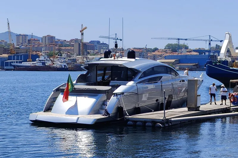 White Shark I Yacht Photos Pics Luxury 2010 Pershing 72 yacht docked in a bustling harbor.